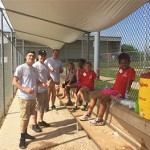 Panera Bread volunteers catching up with reds rookies in the dugout!