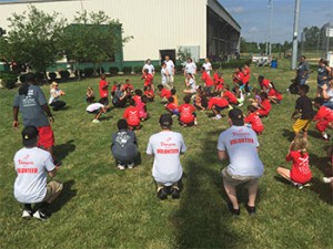 The Reds Rookie kids show Panera employees their yoga moves.